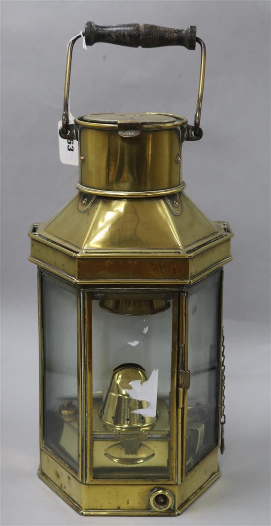 A pair of early Victorian glass lustre drop candlesticks and a brass-cased angled ships bulkhead light